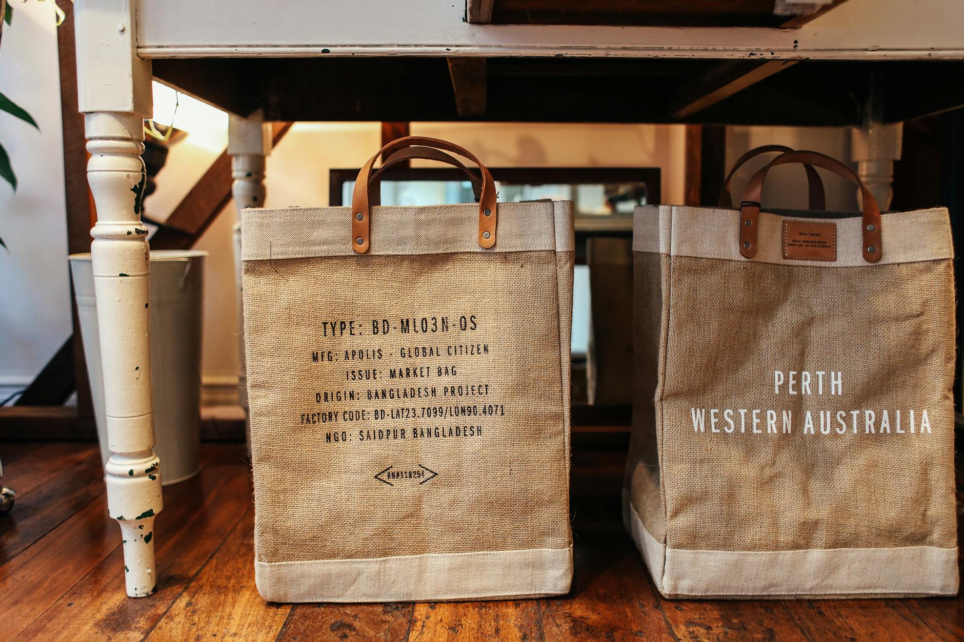 market bags under white wooden table